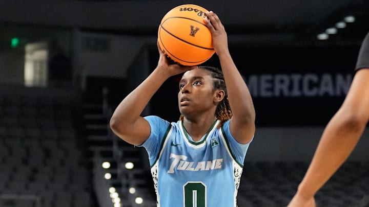 Mar 6, 2023; Fort Worth, TX, USA; Tulane Green Wave guard Kyren Whittington (0) scores a basket against the Cincinnati Bearcats during the first half at Dickies Arena. 