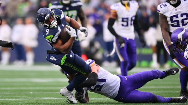 Dec 22, 2024; Seattle, Washington, USA; Seattle Seahawks running back Kenneth Walker III (9) stretches for extra yards during a run play against the Minnesota Vikings in the second half at Lumen Field. Dec 22, 2024; Seattle, Washington, USA; Seattle Seahawks running back Kenneth Walker III (9) stretches for extra yards during a run play against the Minnesota Vikings in the second half at Lumen Field.