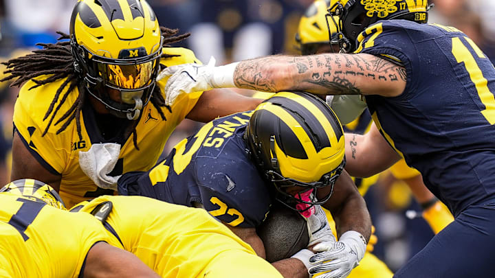 Team Blue running back Justice Haynes (22) runs against Team Maize during the first half of the spring game at Michigan Stadium in Ann Arbor on Saturday, April 19, 2025.