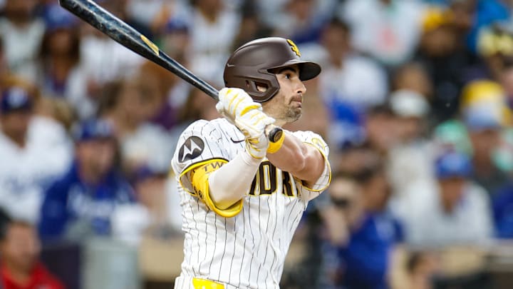 Jun 9, 2025; San Diego, California, USA; San Diego Padres left fielder Tyler Wade (14) hits a three run triple during the third inning against the Los Angeles Dodgers at Petco Park. Mandatory Credit: David Frerker-Imagn Images Jun 9, 2025; San Diego, California, USA; San Diego Padres left fielder Tyler Wade (14) hits a three run triple during the third inning against the Los Angeles Dodgers at Petco Park. Mandatory Credit: David Frerker-Imagn Images