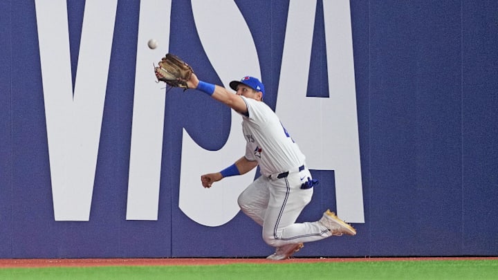 Toronto, Ontario, CAN; Toronto Blue Jays outfielder Daulton Varsho wearing number 42 for Jackie Robinson Day catches a fly ball for an out against the New York Yankees during the seventh inning at Rogers Centre.