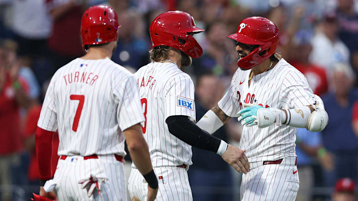 Aug 27, 2024; Philadelphia, Pennsylvania, USA; Philadelphia Phillies outfielder Nick Castellanos (8) celebrates with first base Bryce Harper (3) and shortstop Trea Turner (7) after hitting a three RBI home run against the Houston Astros during the third inning at Citizens Bank Park.