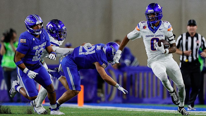 Boise State's Ty Benefield runs the ball back on an interception.