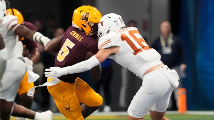 Arizona State wide receiver Melquan Stovall (5) is tackled by Texas defensive back Michael Taaffe (16) after a catch during the fourth quarter in the Chick-fil-A Peach Bowl in Atlanta on Wednesday, Jan. 1, 2025.