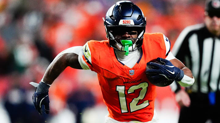 Dec 14, 2025; Denver, Colorado, USA; Denver Broncos running back RJ Harvey (12) runs for a gain during the third quarter against the Green Bay Packers at Empower Field at Mile High. 