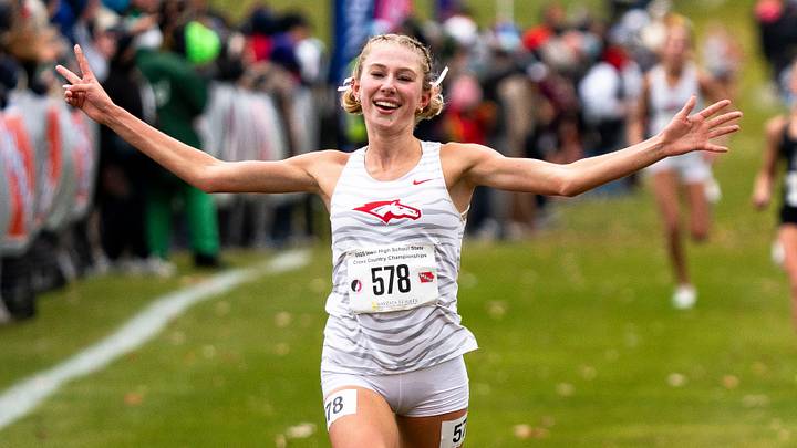 Dallas Center-Grimes' Piper Messerly crosses the finish line during the Iowa high school cross country championships at Lakeside Municipal Golf Course on Saturday, Nov. 1, 2025, in Fort Dodge. Dallas Center-Grimes' Piper Messerly crosses the finish line during the Iowa high school cross country championships at Lakeside Municipal Golf Course on Saturday, Nov. 1, 2025, in Fort Dodge.