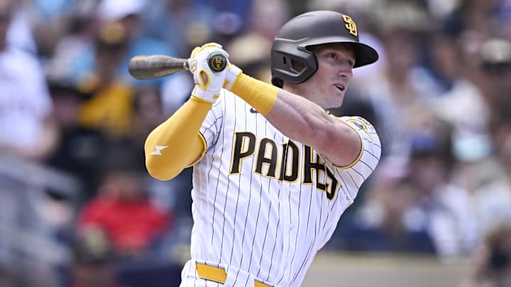 Apr 1, 2026; San Diego, California, USA; San Diego Padres center fielder Bryce Johnson (29) hits a double during the third inning against the San Francisco Giants at Petco Park. Mandatory Credit: Denis Poroy-Imagn Images