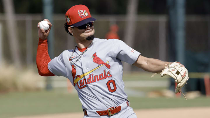 Feb 16, 2026; Jupiter, FL, USA; St. Louis Cardinals shortstop Masyn Winn (0) throws during spring training workouts at Roger Dean Stadium. Mandatory Credit: Reinhold Matay-Imagn Images