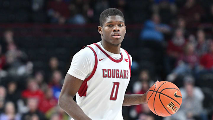 Nov 21, 2024; Spokane, Washington, USA; Washington State Cougars guard Cedric Coward (0) controls the ball against the Eastern Washington Eagles in the second half at Spokane Veterans Memorial Arena. Mandatory Credit: James Snook-Imagn Images