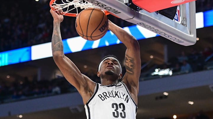 Mar 21, 2024; Milwaukee, Wisconsin, USA; Brooklyn Nets center Nicolas Claxton (33) dunks the ball in the third quarter against the Milwaukee Bucks at Fiserv Forum. Mandatory Credit: Benny Sieu-Imagn Images