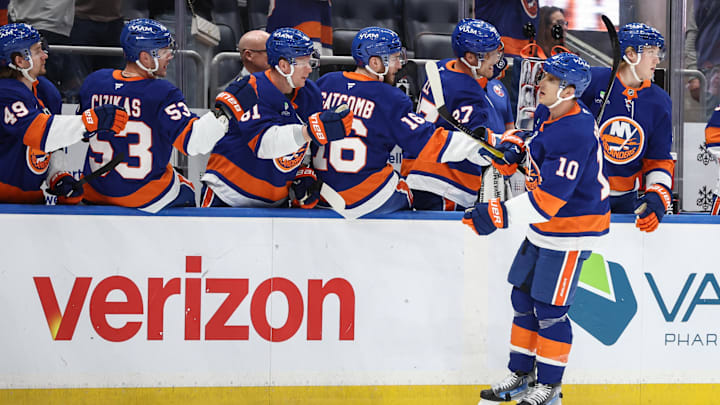 Apr 9, 2026; Elmont, New York, USA;  New York Islanders center Brayden Schenn (10) celebrates with teammates after scoring a goal in the first period against the Toronto Maple Leafs at UBS Arena. Mandatory Credit: Wendell Cruz-Imagn Images