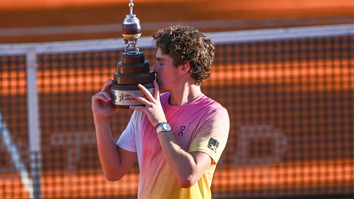 Joao Fonseca of Brazil with the trophy after his men's singles final win over Francisco Cerundolo at IEB+ Argentina Open 2025. Joao Fonseca of Brazil with the trophy after his men's singles final win over Francisco Cerundolo at IEB+ Argentina Open 2025.