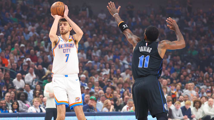May 18, 2024; Dallas, Texas, USA; Oklahoma City Thunder forward Chet Holmgren (7) shoots as Dallas Mavericks guard Kyrie Irving (11) defends during the first quarter in game six of the second round of the 2024 NBA playoffs at American Airlines Center. Mandatory Credit: Kevin Jairaj-Imagn Images