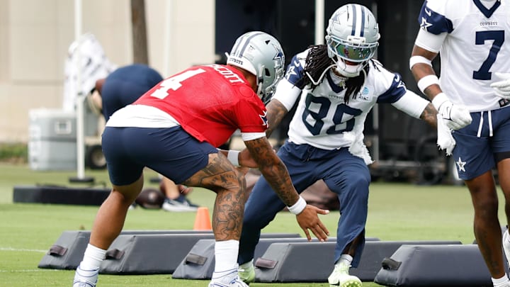 Dallas Cowboys QB Dak Prescott celebrates with WR CeeDee Lamb during a drill at the Ford Center at the Star Training Facility. 