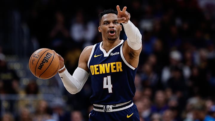 Apr 2, 2025; Denver, Colorado, USA; Denver Nuggets guard Russell Westbrook (4) gestures as he dribbles the ball up court in the third quarter against the San Antonio Spurs at Ball Arena. Mandatory Credit: Isaiah J. Downing-Imagn Images