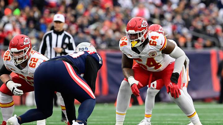 Dec 17, 2023; Foxborough, Massachusetts, USA; Kansas City Chiefs offensive tackle Wanya Morris (64) lines up against New England Patriots defensive end Keion White (99) during the first half at Gillette Stadium. Mandatory Credit: Eric Canha-USA TODAY Sports