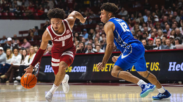 Dec 14, 2024; Tuscaloosa, Alabama, USA; Alabama Crimson Tide guard Mark Sears (1) drives the ball against Creighton Bluejays guard Shane Thomas (12) during the first half at Coleman Coliseum. Mandatory Credit: Will McLelland-Imagn Images