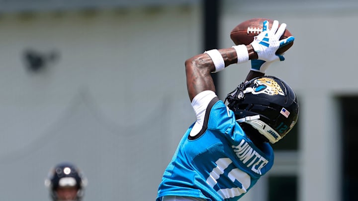 Jacksonville Jaguars wide receiver Travis Hunter (12) hauls in a reception during the first organized team activity at Miller Electric Center Monday, May 19, 2025 in Jacksonville, Fla.