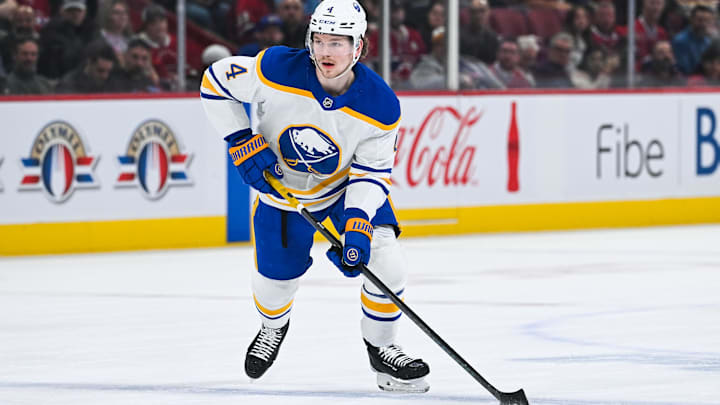 Dec 17, 2024; Montreal, Quebec, CAN; Buffalo Sabres defenseman Bowen Byram (4) plays the puck against the Montreal Canadiens during the first period at Bell Centre. Mandatory Credit: David Kirouac-Imagn Images
