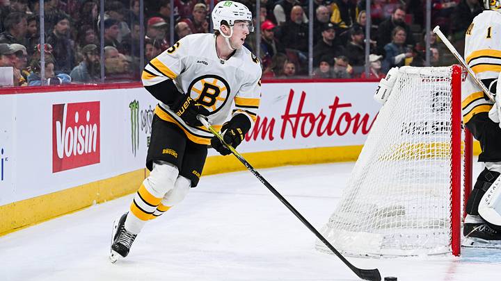 Mar 17, 2026; Montreal, Quebec, CAN; Boston Bruins defenseman Mason Lohrei (6) plays the puck against the Montreal Canadiens during the second period at Bell Centre. Mandatory Credit: David Kirouac-Imagn Images
