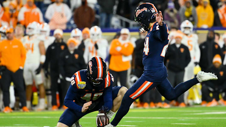 Dec 30, 2025; Nashville, TN, USA;  Illinois Fighting Illini kicker David Olano (24) kicks the game winning field goal against the Tennessee Volunteers during the second half at Nissan Stadium. Mandatory Credit: Steve Roberts-Imagn Images