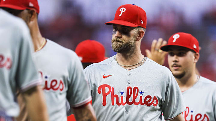 Aug 11, 2025; Cincinnati, Ohio, USA; Philadelphia Phillies first baseman Bryce Harper (3) high fives teammates after the victory over the Cincinnati Reds at Great American Ball Park. 