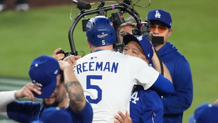 Oct 27, 2025; Los Angeles, California, USA; Los Angeles Dodgers first baseman Freddie Freeman (5) celebrates with manager Dave Roberts (30) after hitting a walk off home run in the eighteenth inning against the Toronto Blue Jays during game three of the 2025 MLB World Series at Dodger Stadium. Mandatory Credit: Kirby Lee-Imagn Images Oct 27, 2025; Los Angeles, California, USA; Los Angeles Dodgers first baseman Freddie Freeman (5) celebrates with manager Dave Roberts (30) after hitting a walk off home run in the eighteenth inning against the Toronto Blue Jays during game three of the 2025 MLB World Series at Dodger Stadium. Mandatory Credit: Kirby Lee-Imagn Images