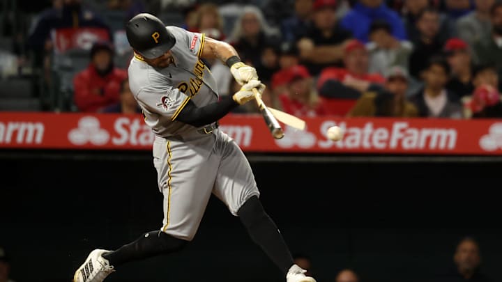 Apr 23, 2025; Anaheim, California, USA;  Pittsburgh Pirates left fielder Tommy Pham (28) hits an RBI single during the ninth inning against the Los Angeles Angels at Angel Stadium. Mandatory Credit: Kiyoshi Mio-Imagn Images