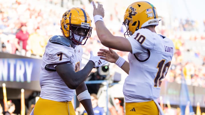 Arizona State Sun Devils tight end Chamon Metayer (7) celebrates a touchdown with quarterback Sam Leavitt (10) against the Arizona Wildcats.