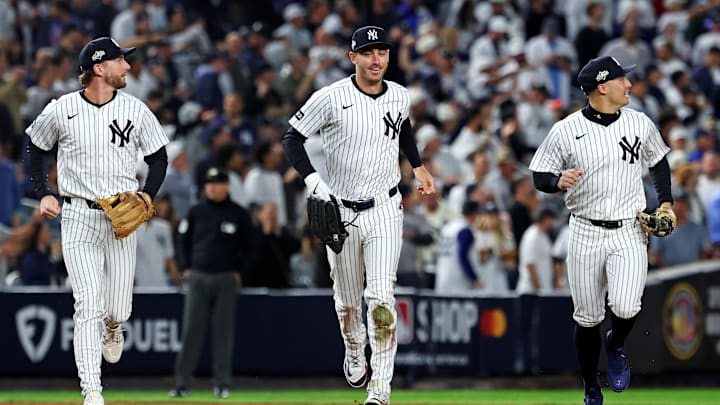 Oct 8, 2025; Bronx, New York, USA; New York Yankees left fielder Cody Bellinger (35) runs off the field after ending the first inning with a sliding catch against the Toronto Blue Jays during game four of the ALDS round for the 2025 MLB playoffs at Yankee Stadium. Mandatory Credit: Vincent Carchietta-Imagn Images