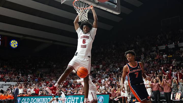 Mar 7, 2026; Tuscaloosa, Alabama, USA; Alabama Crimson Tide forward London Jemison (6) hangs onto the rim after his dunk during the second half against the Auburn Tigers at Coleman Coliseum. Mandatory Credit: David Leong-Imagn Images Mar 7, 2026; Tuscaloosa, Alabama, USA; Alabama Crimson Tide forward London Jemison (6) hangs onto the rim after his dunk during the second half against the Auburn Tigers at Coleman Coliseum. Mandatory Credit: David Leong-Imagn Images