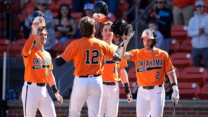 Oklahoma State's Colin Brueggemann (12) celebrates his home run with Jayson Jones (23), Oklahoma State's Nolan Schubart (10) and Aidan Meola (2) during the college baseball game between the Oklahoma State University Cowboys and the UT Arlington at O'Brate Stadium in Stillwater, Okla., Sunday, Feb., 23, 2025.