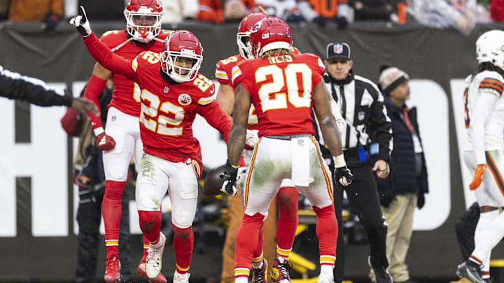 Chiefs cornerback Trent McDuffie (22), the former Husky, celebrates his first NFL interception against the Cleveland Browns.