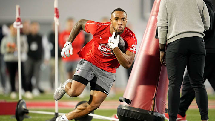 Ohio State Buckeyes running back TreVeyon Henderson works out during the pro day for NFL scouts.