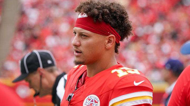 Aug 26, 2023; Kansas City, Missouri, USA; Kansas City Chiefs quarterback Patrick Mahomes (15) talks with players on the sidelines against the Cleveland Browns during the game at GEHA Field at Arrowhead Stadium. Mandatory Credit: Denny Medley-Imagn Images