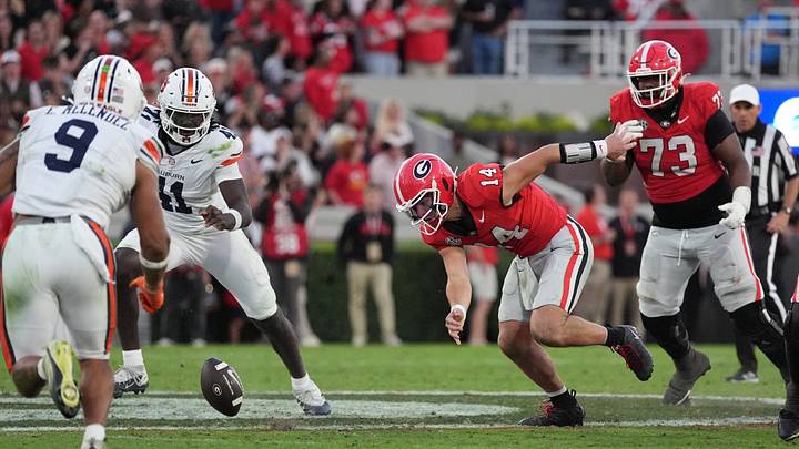 Oct 17, 2026; Athens, Georgia, USA; Georgia quarterback Gunner Stockton (14) fumbles the ball during the fourth quarter against Auburn at Sanford Stadium. Mandatory Credit: Dale Zanine-Imagn Images Oct 17, 2026; Athens, Georgia, USA; Georgia quarterback Gunner Stockton (14) fumbles the ball during the fourth quarter against Auburn at Sanford Stadium. Mandatory Credit: Dale Zanine-Imagn Images