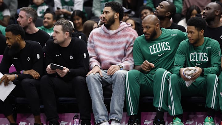 Dec 4, 2025; Washington, District of Columbia, USA; Injured Boston Celtics forward Jayson Tatum (M) looks on from the bench against the Washington Wizards in the first half at Capital One Arena. Mandatory Credit: Geoff Burke-Imagn Images