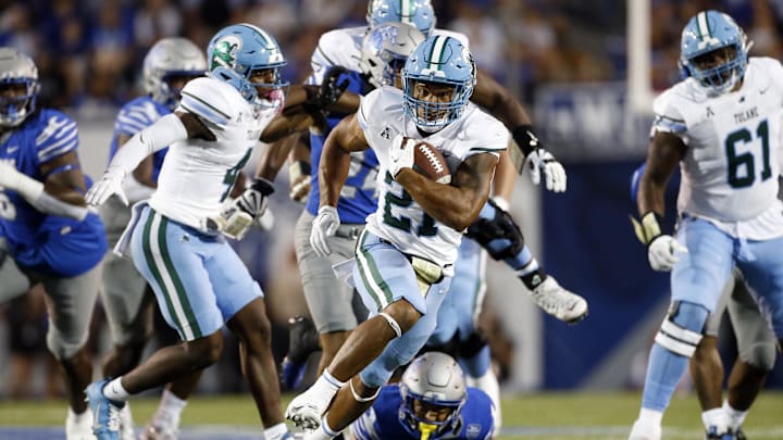 Oct 13, 2023; Memphis, Tennessee, USA; Tulane Green Wave running back Makhi Hughes (21) runs with the ball during the first half against the Memphis Tigers at Simmons Bank Liberty Stadium.