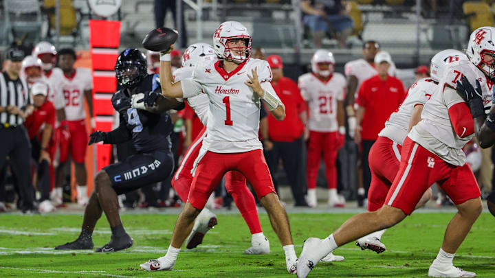 Nov 7, 2025; Orlando, Florida, USA; Houston Cougars quarterback Conner Weigman (1) drops back to pass during the first quarter against the UCF Knights at Acrisure Bounce House. Mandatory Credit: Mike Watters-Imagn Images Nov 7, 2025; Orlando, Florida, USA; Houston Cougars quarterback Conner Weigman (1) drops back to pass during the first quarter against the UCF Knights at Acrisure Bounce House. Mandatory Credit: Mike Watters-Imagn Images