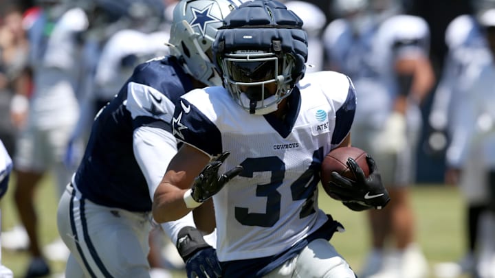 Dallas Cowboys running back Malik Davis runs during training camp at the River Ridge Playing Fields in Oxnard, California. 