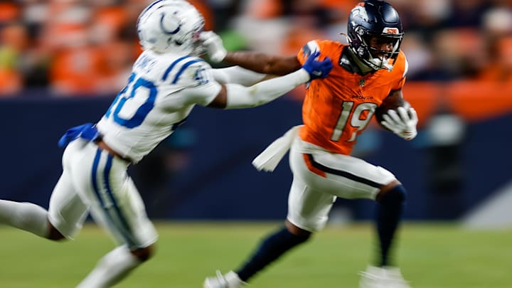Dec 15, 2024; Denver, Colorado, USA; Denver Broncos wide receiver Marvin Mims Jr. (19) runs the ball against Indianapolis Colts cornerback Jaylon Jones (40) in the fourth quarter at Empower Field at Mile High. Mandatory Credit: Isaiah J. Downing-Imagn Images Dec 15, 2024; Denver, Colorado, USA; Denver Broncos wide receiver Marvin Mims Jr. (19) runs the ball against Indianapolis Colts cornerback Jaylon Jones (40) in the fourth quarter at Empower Field at Mile High. Mandatory Credit: Isaiah J. Downing-Imagn Images