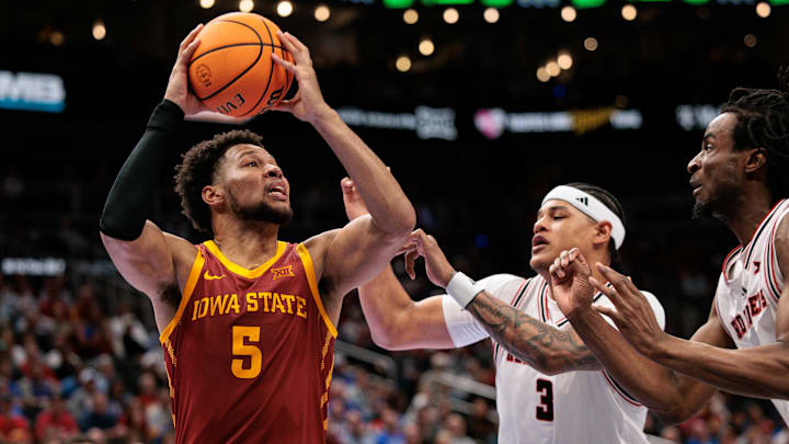 Mar 12, 2026; Kansas City, MO, USA; Iowa State Cyclones forward Joshua Jefferson (5) drives to the basket around Texas Tech Red Raiders forward LeJuan Watts (3) during the second half at T-Mobile Center. Mar 12, 2026; Kansas City, MO, USA; Iowa State Cyclones forward Joshua Jefferson (5) drives to the basket around Texas Tech Red Raiders forward LeJuan Watts (3) during the second half at T-Mobile Center.