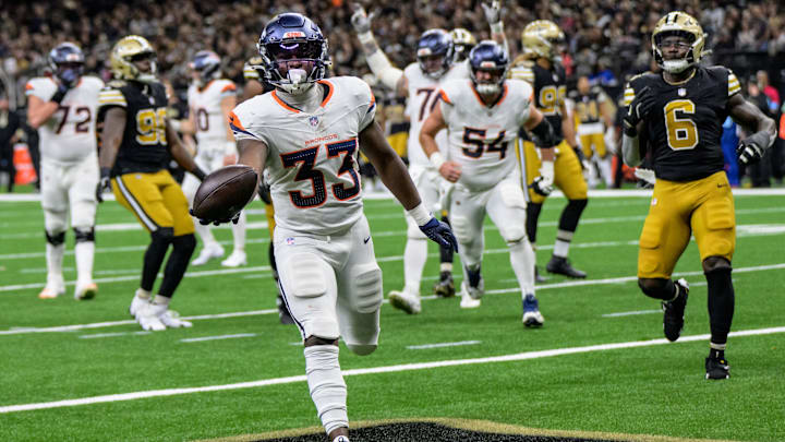Denver Broncos running back Javonte Williams scores a touchdown against the New Orleans Saints.
