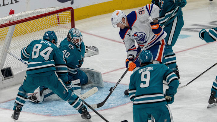 Apr 16, 2025; San Jose, California, USA;  Edmonton Oilers right wing Corey Perry (90) shoots the puck against San Jose Sharks goaltender Alexandar Georgiev (40) during the third period at SAP Center at San Jose. Mandatory Credit: Neville E. Guard-Imagn Images