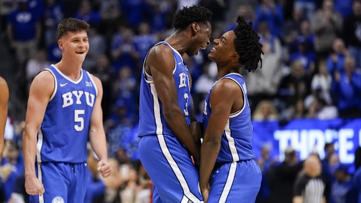 Jan 24, 2026; Provo, Utah, USA; BYU Cougars forward AJ Dybantsa (3) celebrates with guard Robert Wright III (1) during the second half against the Utah Utes at Marriott Center. Mandatory Credit: Aaron Baker-Imagn Images 