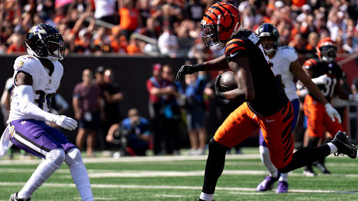 Cincinnati Bengals wide receiver Tee Higgins (5) scores a touchdown as Baltimore Ravens free safety Eddie Jackson (39) looks on in the second quarter of the NFL game at Paycor Stadium in Cincinnati on Sunday, Oct. 6, 2024. Cincinnati Bengals wide receiver Tee Higgins (5) scores a touchdown as Baltimore Ravens free safety Eddie Jackson (39) looks on in the second quarter of the NFL game at Paycor Stadium in Cincinnati on Sunday, Oct. 6, 2024.