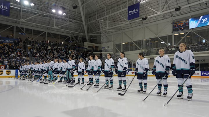 Jan 1, 2024; Toronto, Ontario, CANADA; New York  players line up during the anthems before the inaugural PWHL ice hockey game against Toronto at Mattamy Athletic Centre. Mandatory Credit: John E. Sokolowski-Imagn Images