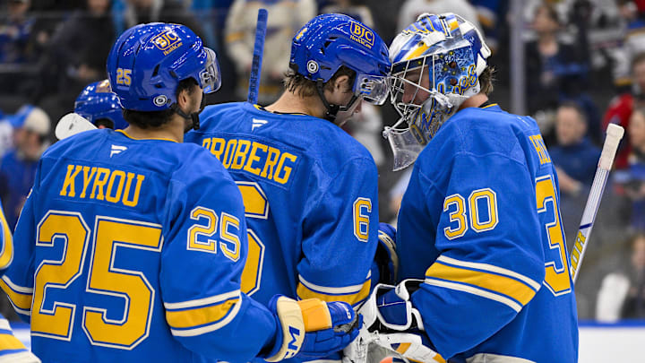 Mar 22, 2025; St. Louis, Missouri, USA;  St. Louis Blues goaltender Joel Hofer (30) and defenseman Philip Broberg (6) celebrate after the Blues defeated the Chicago Blackhawks at Enterprise Center. Mandatory Credit: Jeff Curry-Imagn Images