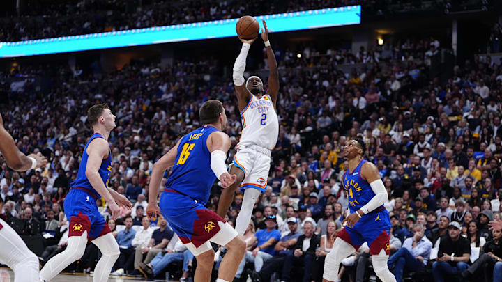 May 9, 2025; Denver, Colorado, USA; Denver Nuggets guard Christian Braun (0),center Nikola Jokic (15) and guard Russell Westbrook (4) watch as Oklahoma City Thunder guard Shai Gilgeous-Alexander (2) prepares to shoot the ball in the second quarter during game three of the second round for the 2025 NBA Playoffs at Ball Arena. Mandatory Credit: Ron Chenoy-Imagn Images May 9, 2025; Denver, Colorado, USA; Denver Nuggets guard Christian Braun (0),center Nikola Jokic (15) and guard Russell Westbrook (4) watch as Oklahoma City Thunder guard Shai Gilgeous-Alexander (2) prepares to shoot the ball in the second quarter during game three of the second round for the 2025 NBA Playoffs at Ball Arena. Mandatory Credit: Ron Chenoy-Imagn Images