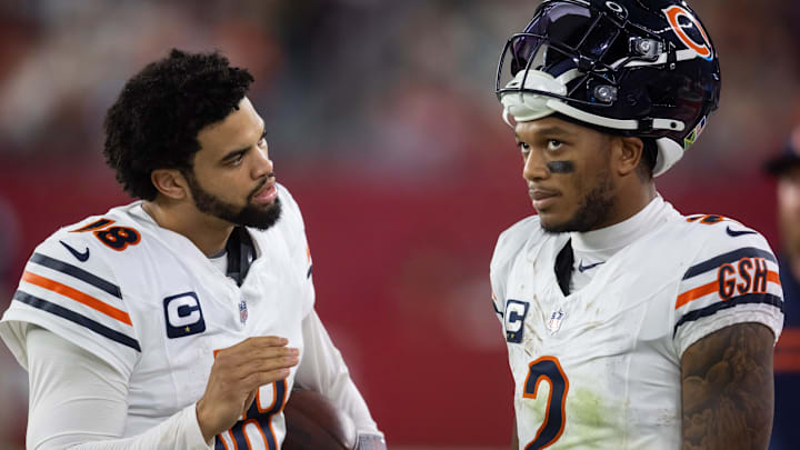Caleb Williams explains some point about the offense to wide receiver DJ Moore during the Bears' loss at Arizona. Caleb Williams explains some point about the offense to wide receiver DJ Moore during the Bears' loss at Arizona.